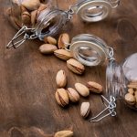 arrangement-overturned-jars-filled-with-pistachos