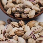 close-up-spilled-pistachios-bowl