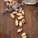 overturned-glass-jar-with-roasted-pistachio-nuts